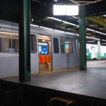 Photo of a subway train film set styled to look like a New York subway platform.