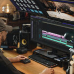 A man edits video on a computer.